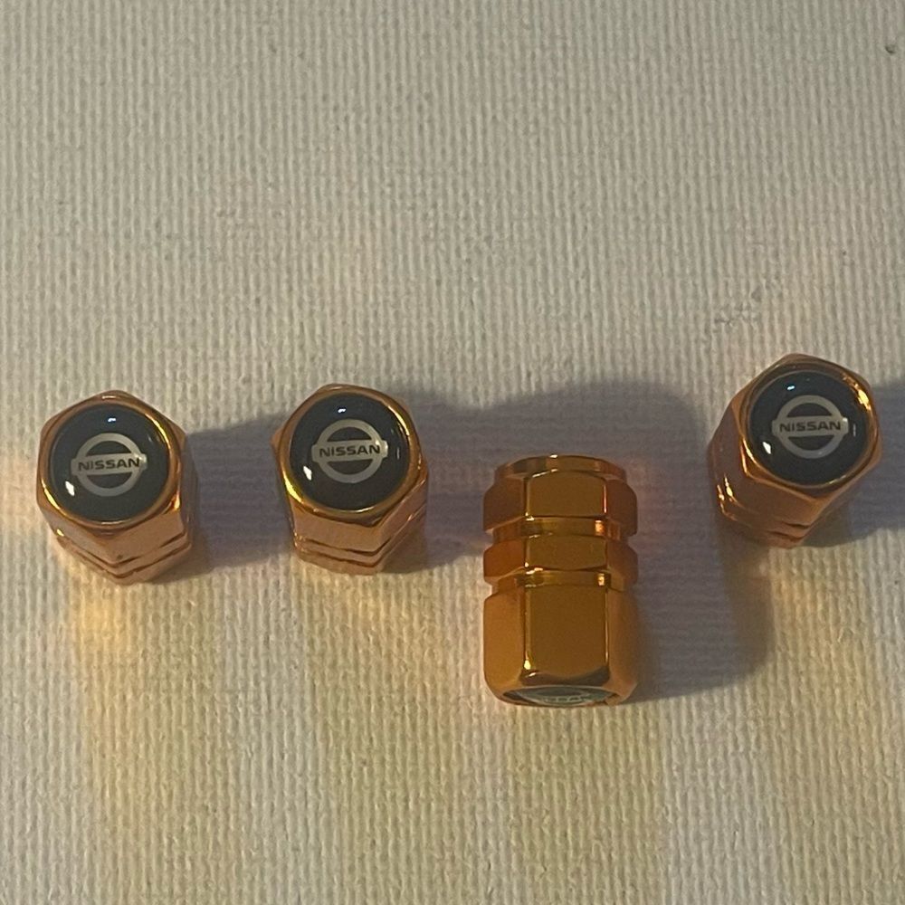 Nissan Logo Valve Stem caps in Gold set of 4 NWT